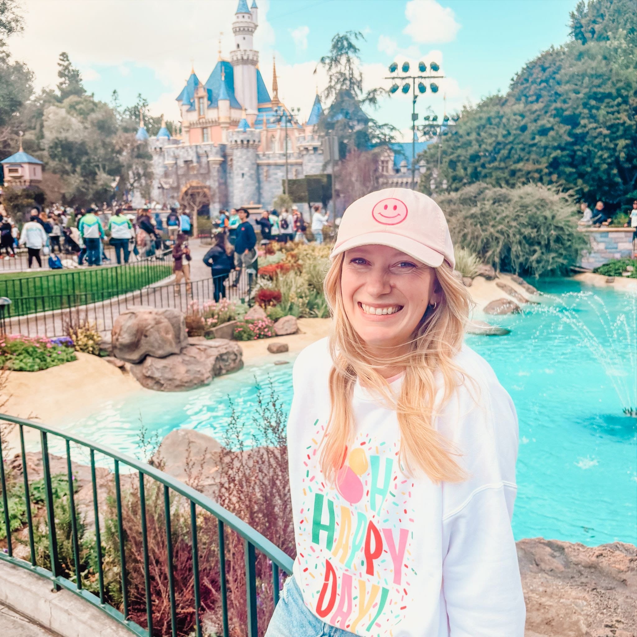 Brittany ConciEARS Disney Travel Planner in front of the castle at Disneyland
