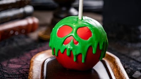 Spooky green and red candy apple for the Halloween Disney Foodie Guide